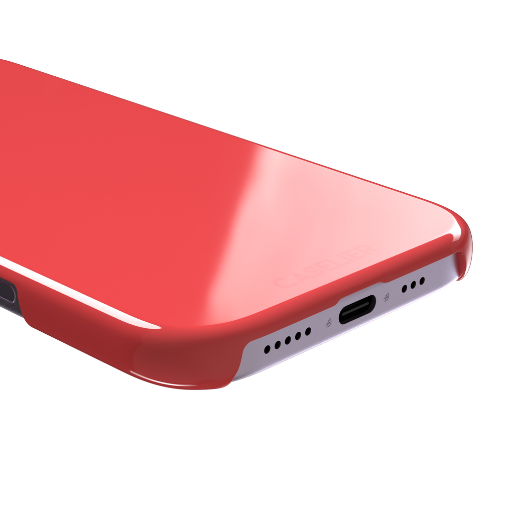 Solid coral red matte phone case color variant, phone case by Caselier — snap case, charging port detail