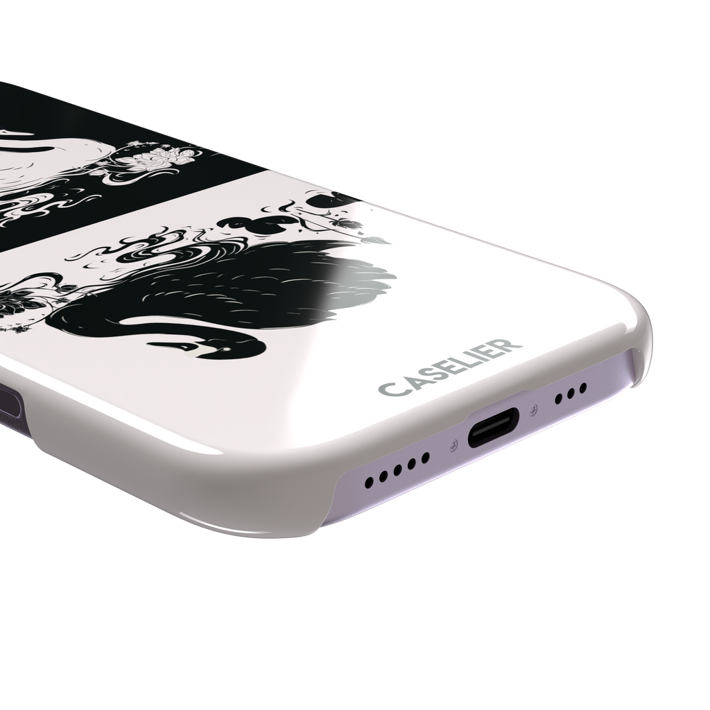 Reflection phone case showing a white swan on a black upper half mirrored by a black swan on a cream lower half, surrounded by lotus flowers and swirling water in ink illustration style — snap case, charging port detail