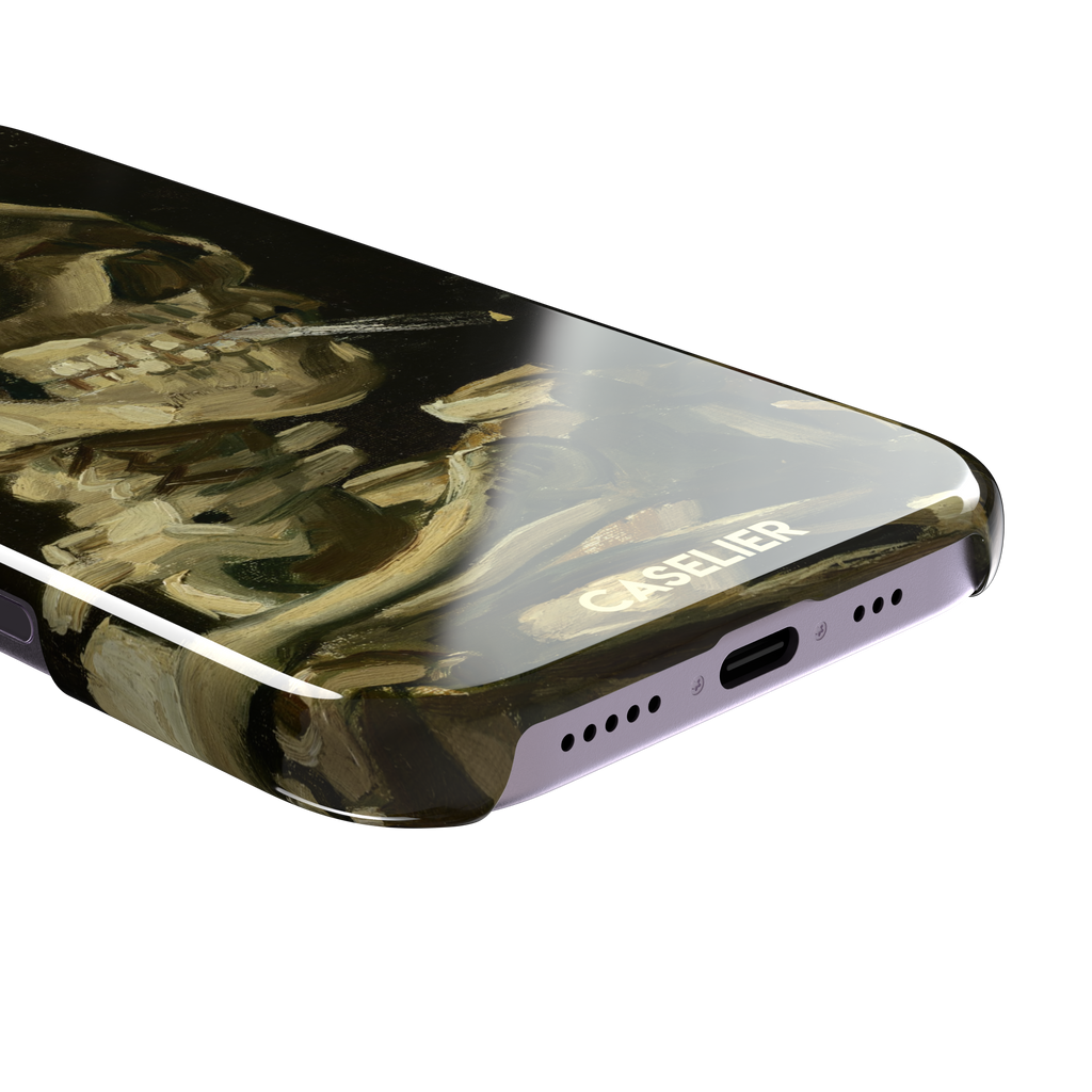 Skull of a Skeleton with Burning Cigarette by Vincent van Gogh phone case, featuring a grinning skeleton with a lit cigarette in olive, ochre and black oil-painting brushwork on a dark background, phone case by Caselier — snap case, charging port detail