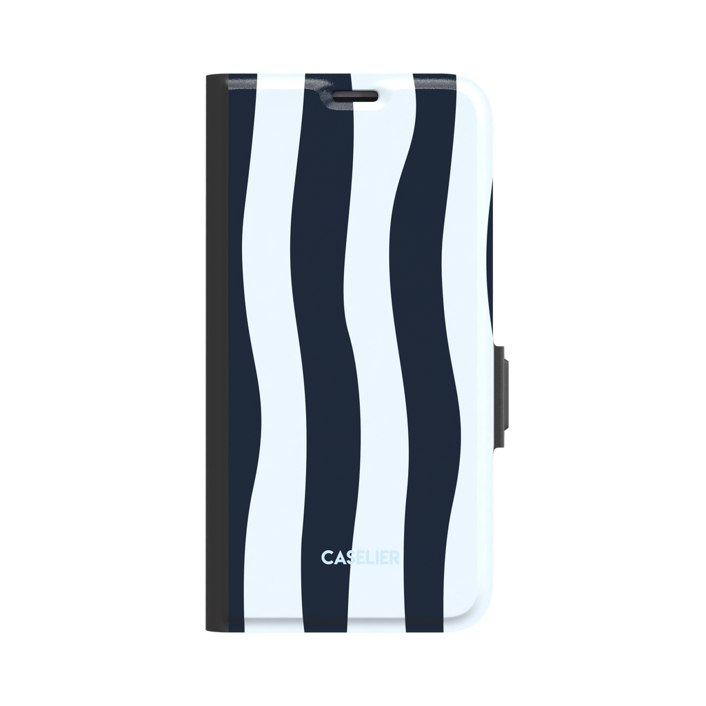 Sloppy Stripes folio wallet case in navy and ice blue wavy stripe design, front cover closed showing full stripe pattern with black spine and clasp, white background, phone case by Caselier - wallet case, front view | Caselier