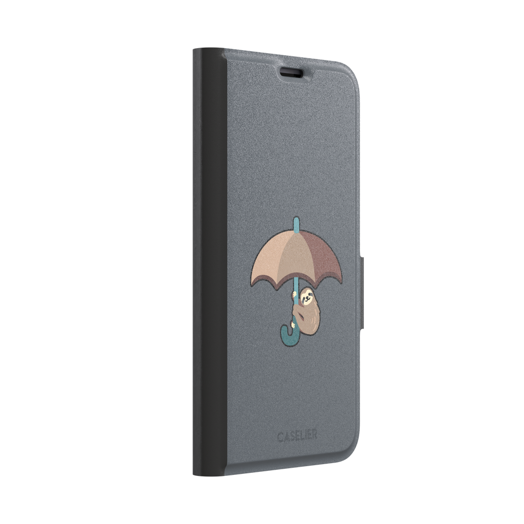 Grey phone case featuring a cute cartoon sloth hanging from a brown and beige umbrella with a teal handle, phone case by Caselier — wallet case, left view