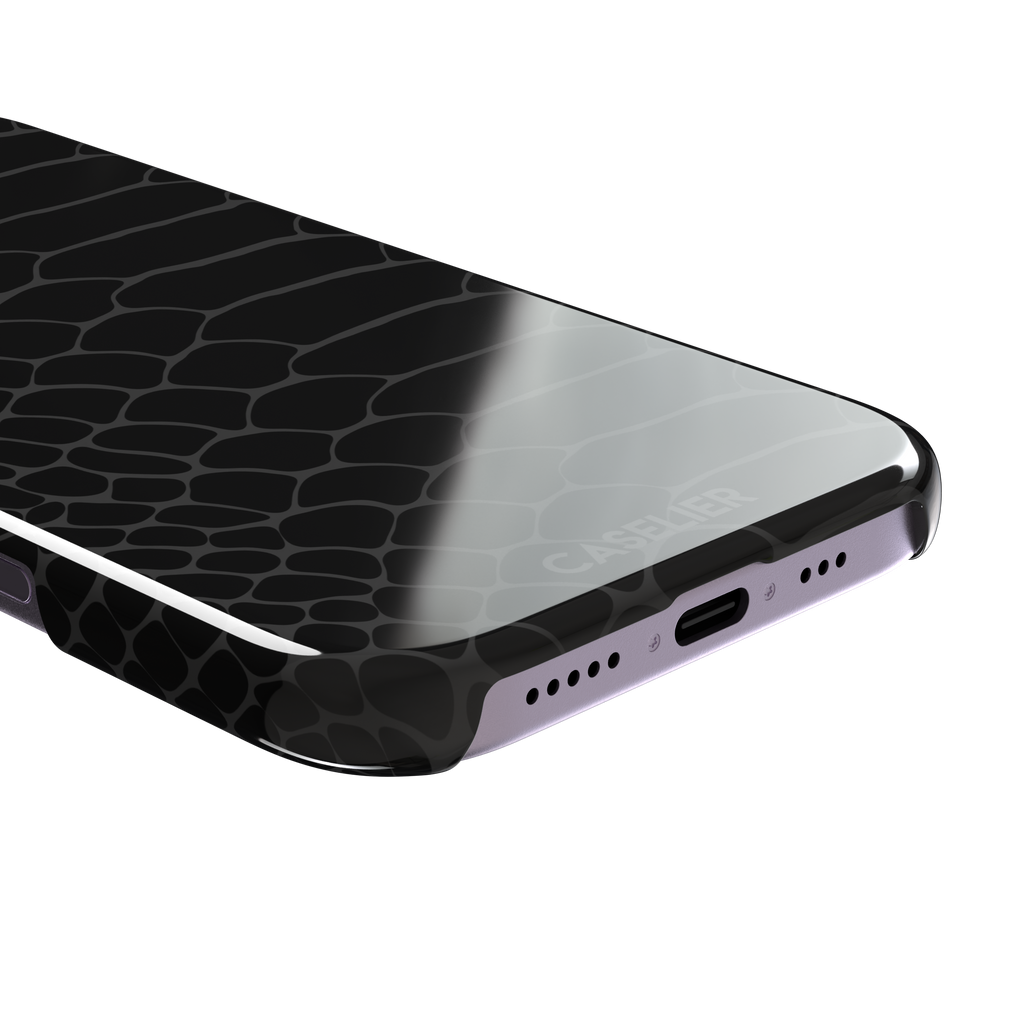 All-black snakeskin print phone case with dark charcoal scale outlines for a sleek monochrome look, phone case by Caselier — snap case, charging port detail