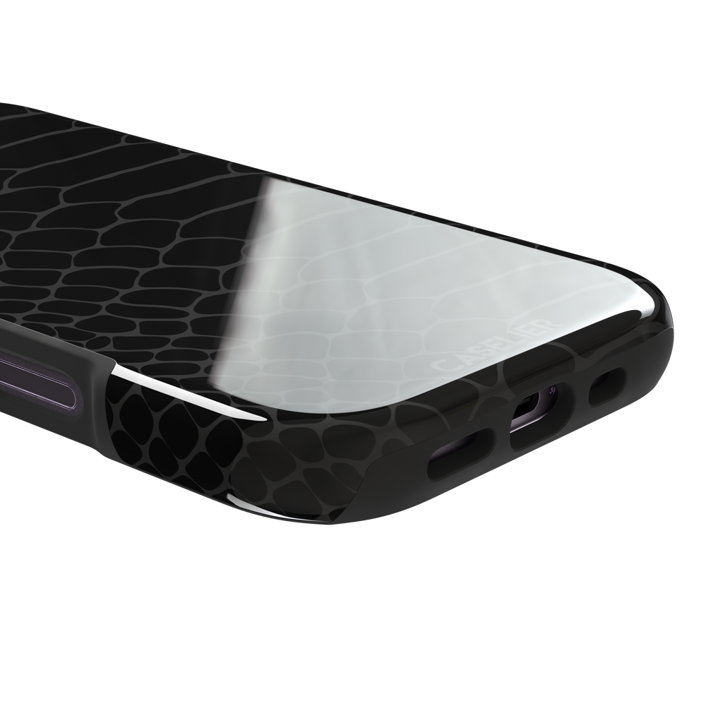 All-black snakeskin print phone case with dark charcoal scale outlines for a sleek monochrome look, phone case by Caselier — tough case, charging port detail