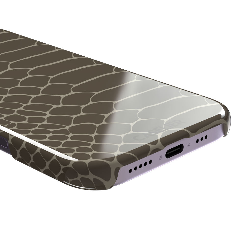 Khaki and taupe snakeskin print phone case with earthy brown scale outlines on a warm grey-brown base, phone case by Caselier — snap case, charging port detail