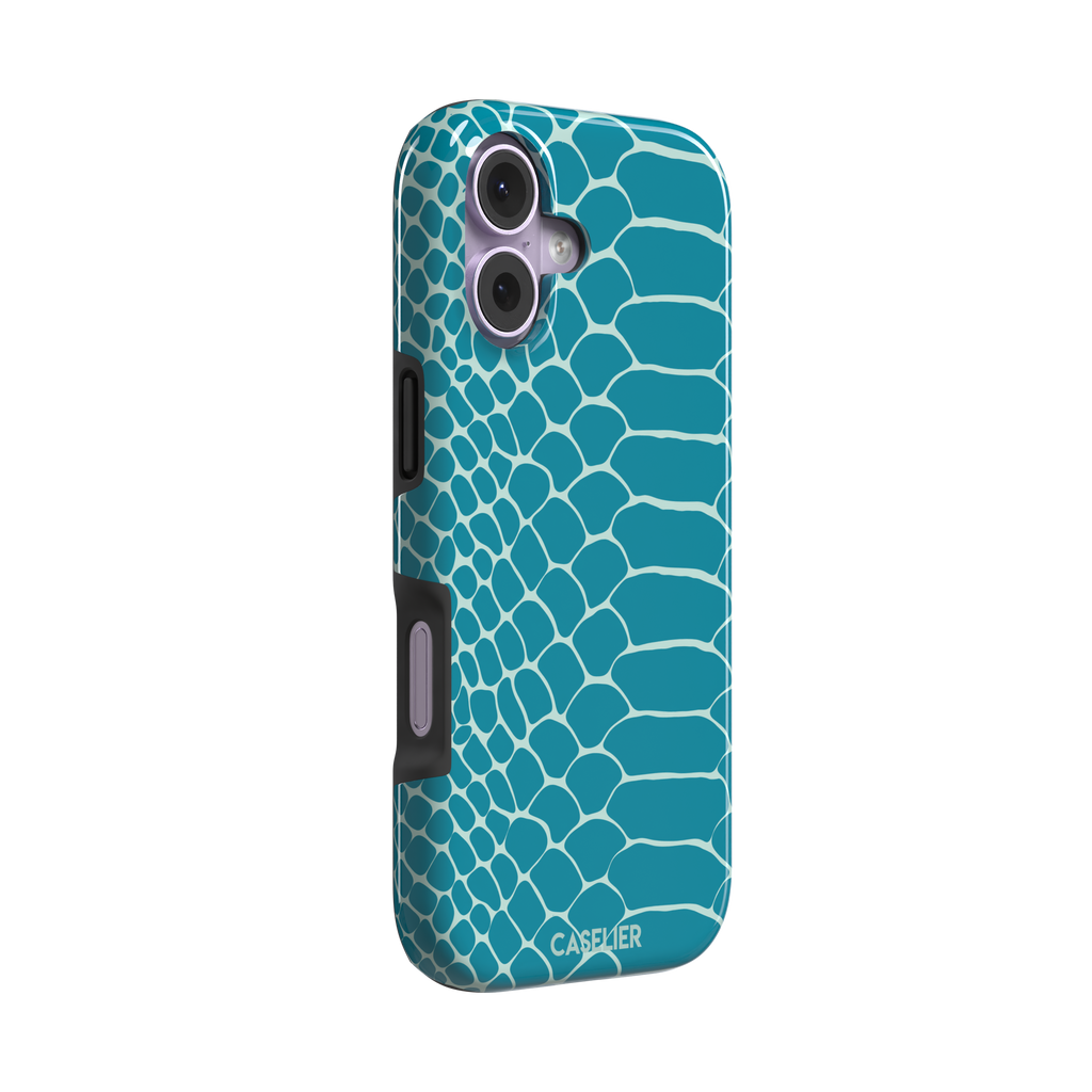 Teal and white snakeskin print phone case with bold reptile scale pattern covering the full back, phone case by Caselier — tough case, left view