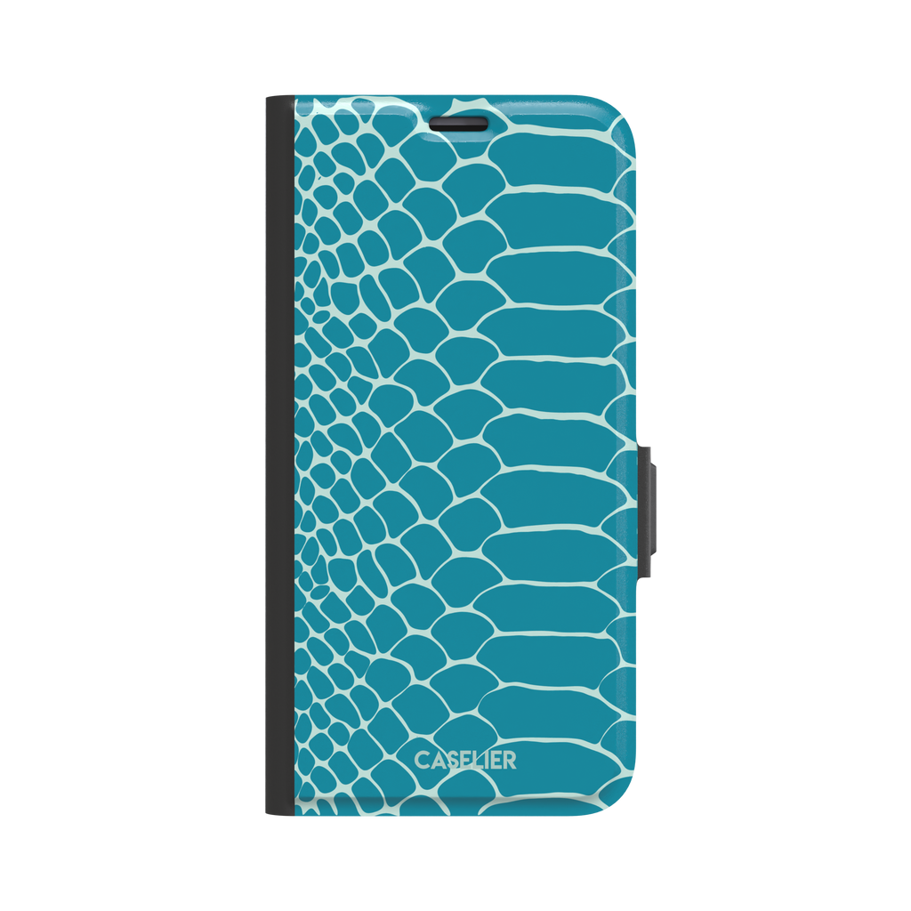 Teal and white snakeskin print phone case with bold reptile scale pattern covering the full back, phone case by Caselier — wallet case, front view