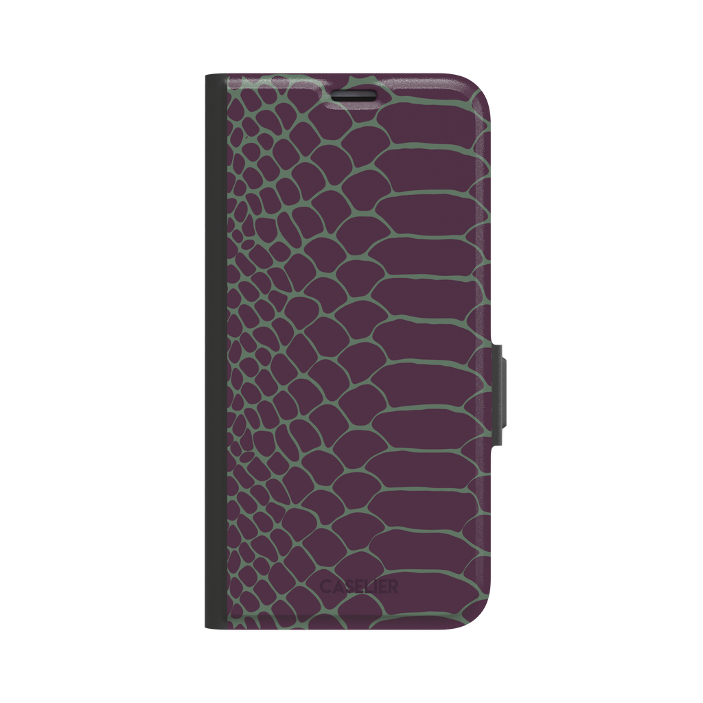 Deep plum and sage green snakeskin print phone case with muted green scale outlines on a rich purple base, phone case by Caselier — wallet case, front view