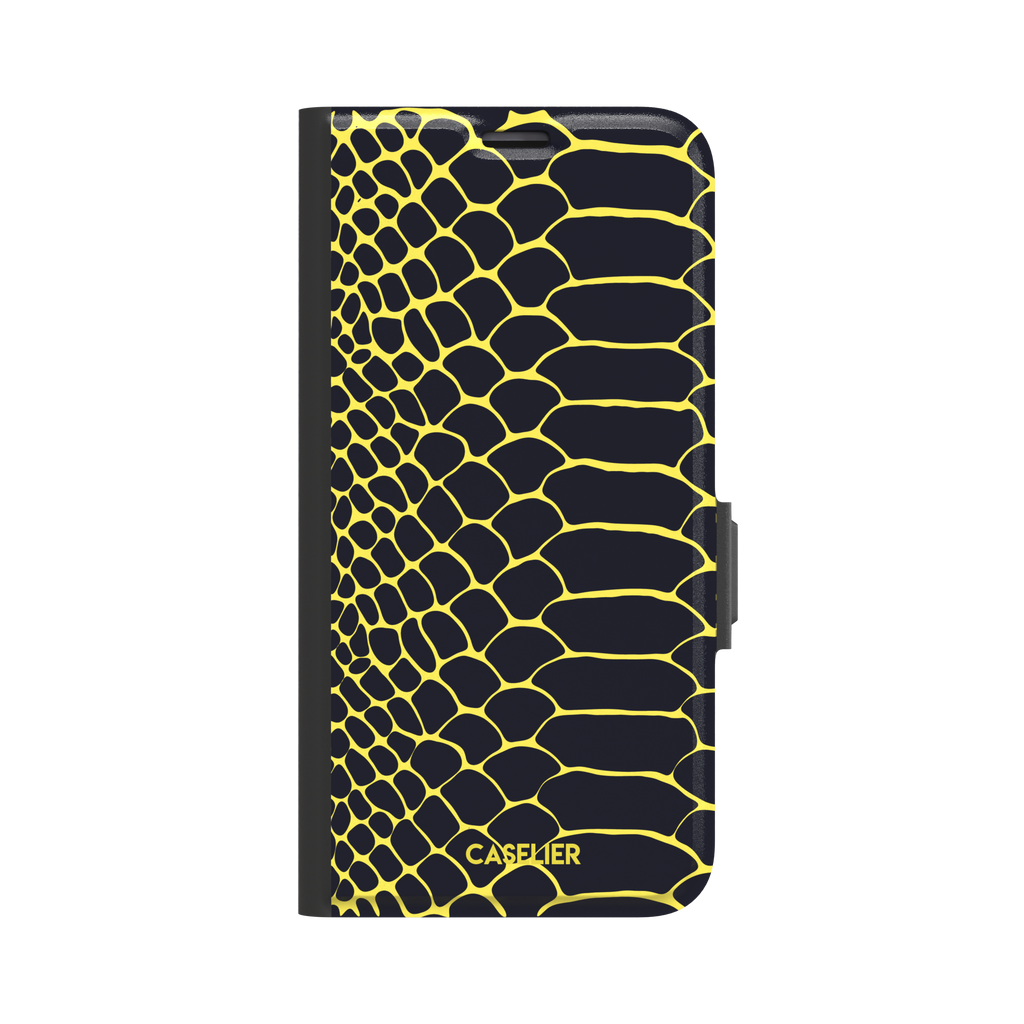Navy and yellow snakeskin print phone case with vivid yellow scale outlines on a deep dark blue background, phone case by Caselier — wallet case, front view