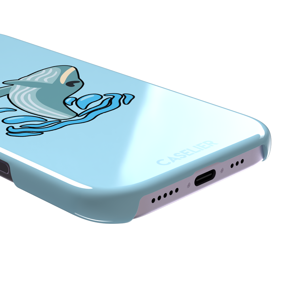 Sky-blue phone case featuring a cute cartoon humpback whale breaching from splashing waves, rendered in teal and cream with bold outlines, phone case by Caselier — snap case, charging port detail