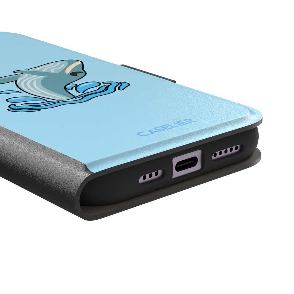 Sky-blue phone case featuring a cute cartoon humpback whale breaching from splashing waves, rendered in teal and cream with bold outlines, phone case by Caselier — wallet case, charging port detail