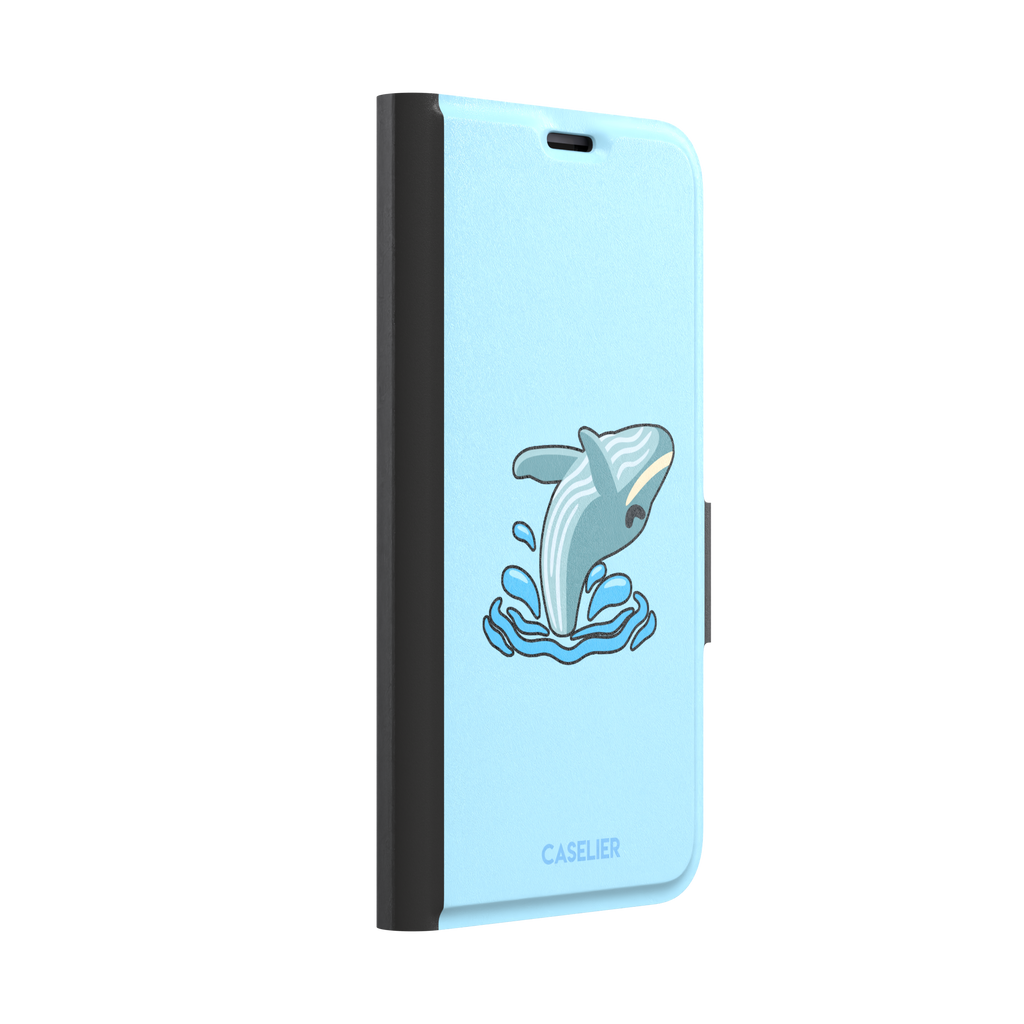 Sky-blue phone case featuring a cute cartoon humpback whale breaching from splashing waves, rendered in teal and cream with bold outlines, phone case by Caselier — wallet case, left view