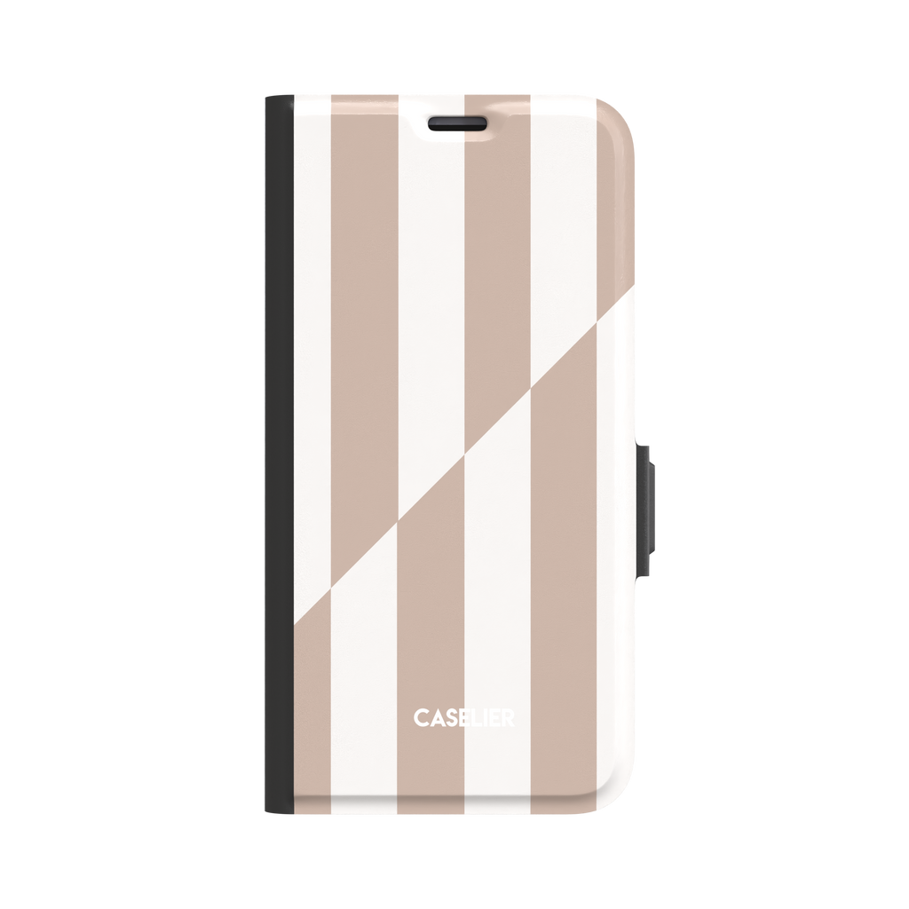 Split Stripes folio wallet phone case in beige and white vertical stripes with diagonal split, front-facing view showing black spine and side clasp, white background, phone case by Caselier - wallet case, front view | Caselier