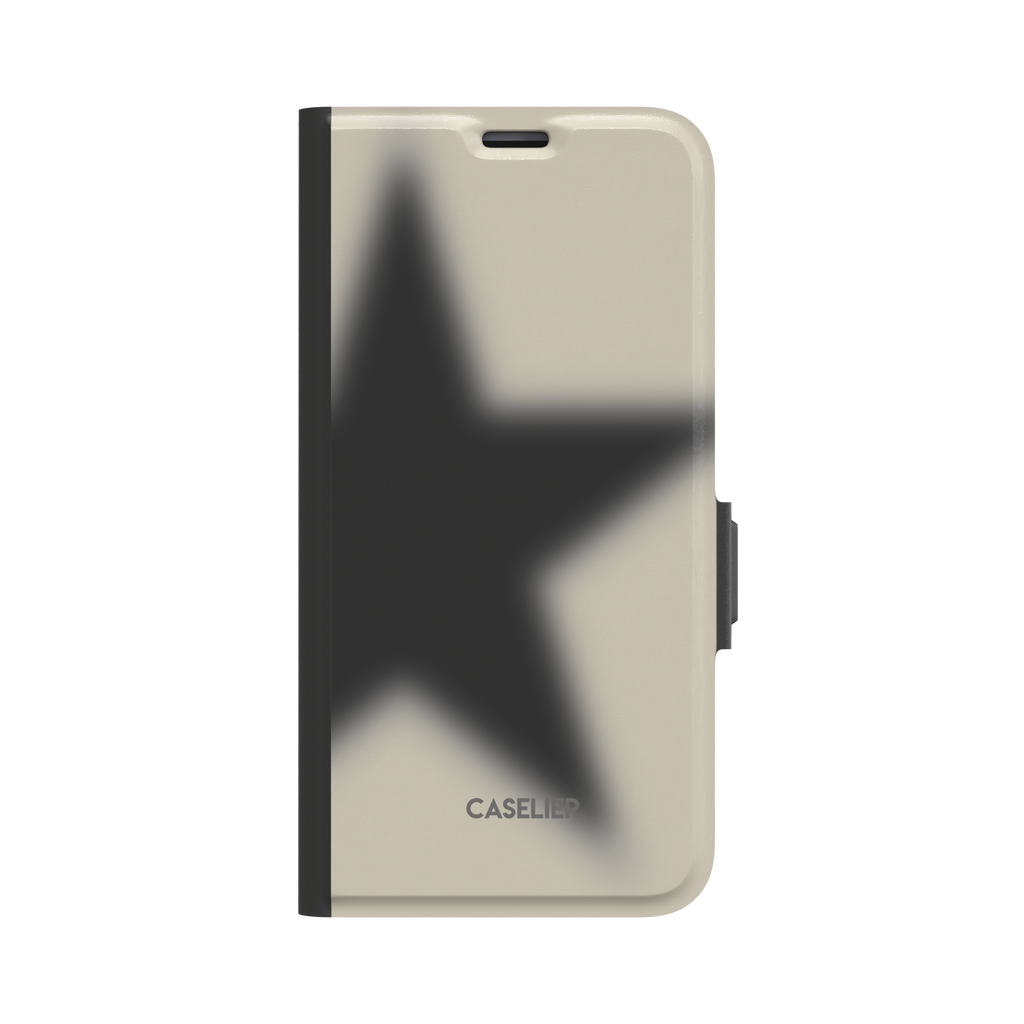 Folio wallet phone case with a blurred charcoal-black star on a warm ecru cover, black spine and clasp, front view on white background, phone case by Caselier - wallet case, front view | Caselier