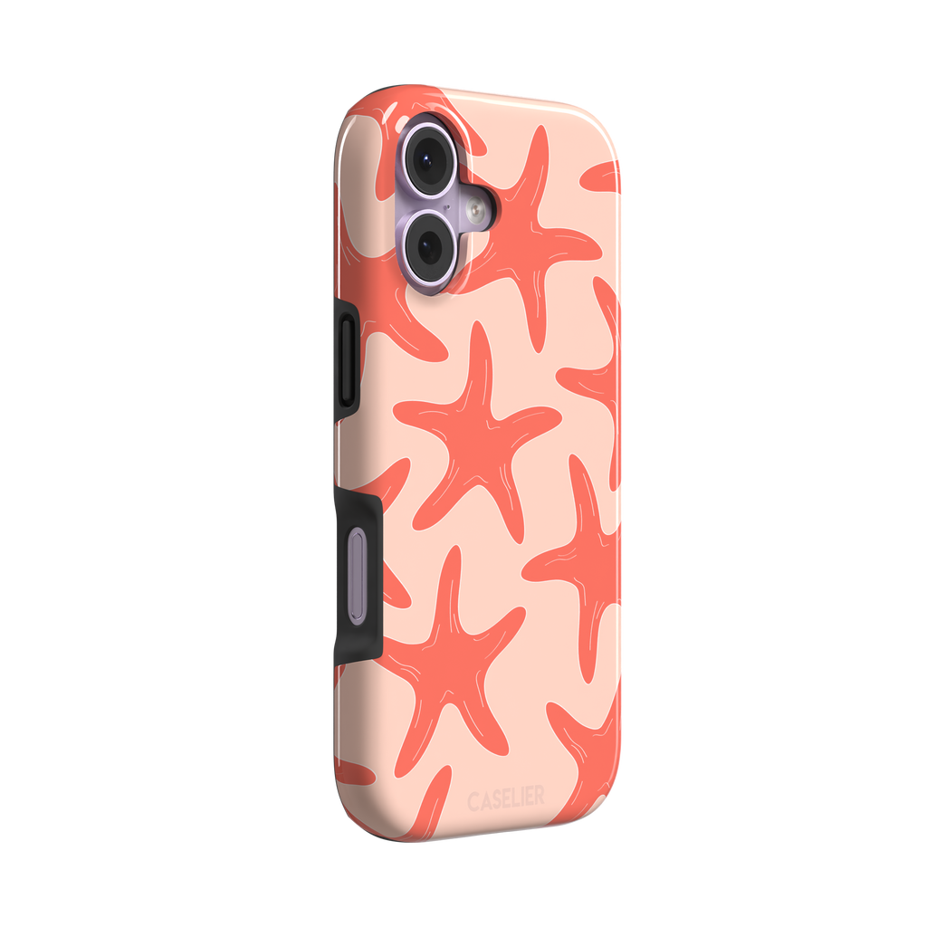 Starfish phone case with bold coral starfish pattern on a soft peach background, part of the Memories of Summer collection, phone case by Caselier — tough case, left view