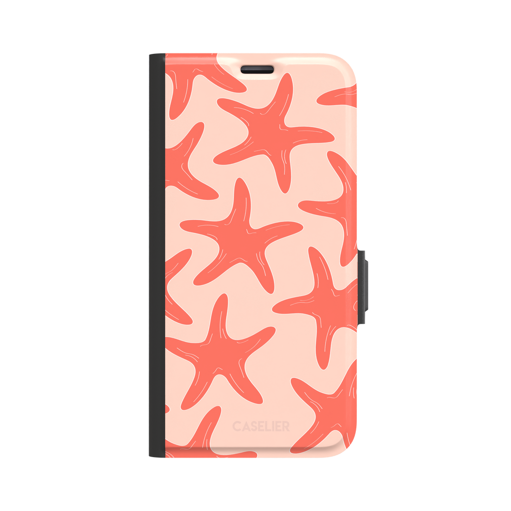 Starfish phone case with bold coral starfish pattern on a soft peach background, part of the Memories of Summer collection, phone case by Caselier — wallet case, front view