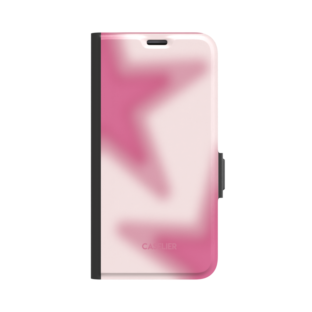 Stars Blur folio wallet case in pink — blurred rose and blush white aura gradient with soft star forms across the cover, black spine and clasp, front view on white background, phone case by Caselier - wallet case, front view | Caselier