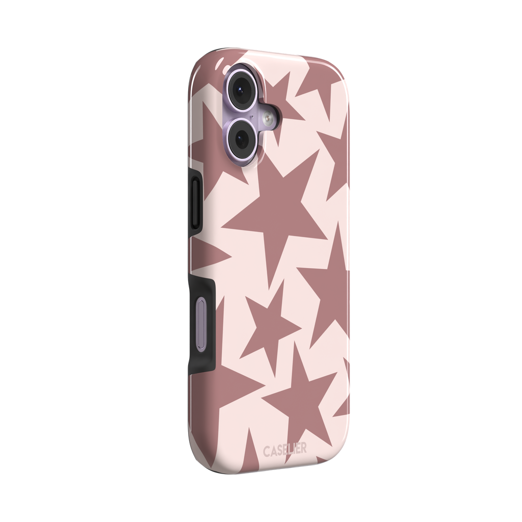 Stars phone case variant in dusty rose and blush pink with oversized scattered star pattern, phone case by Caselier — tough case, left view