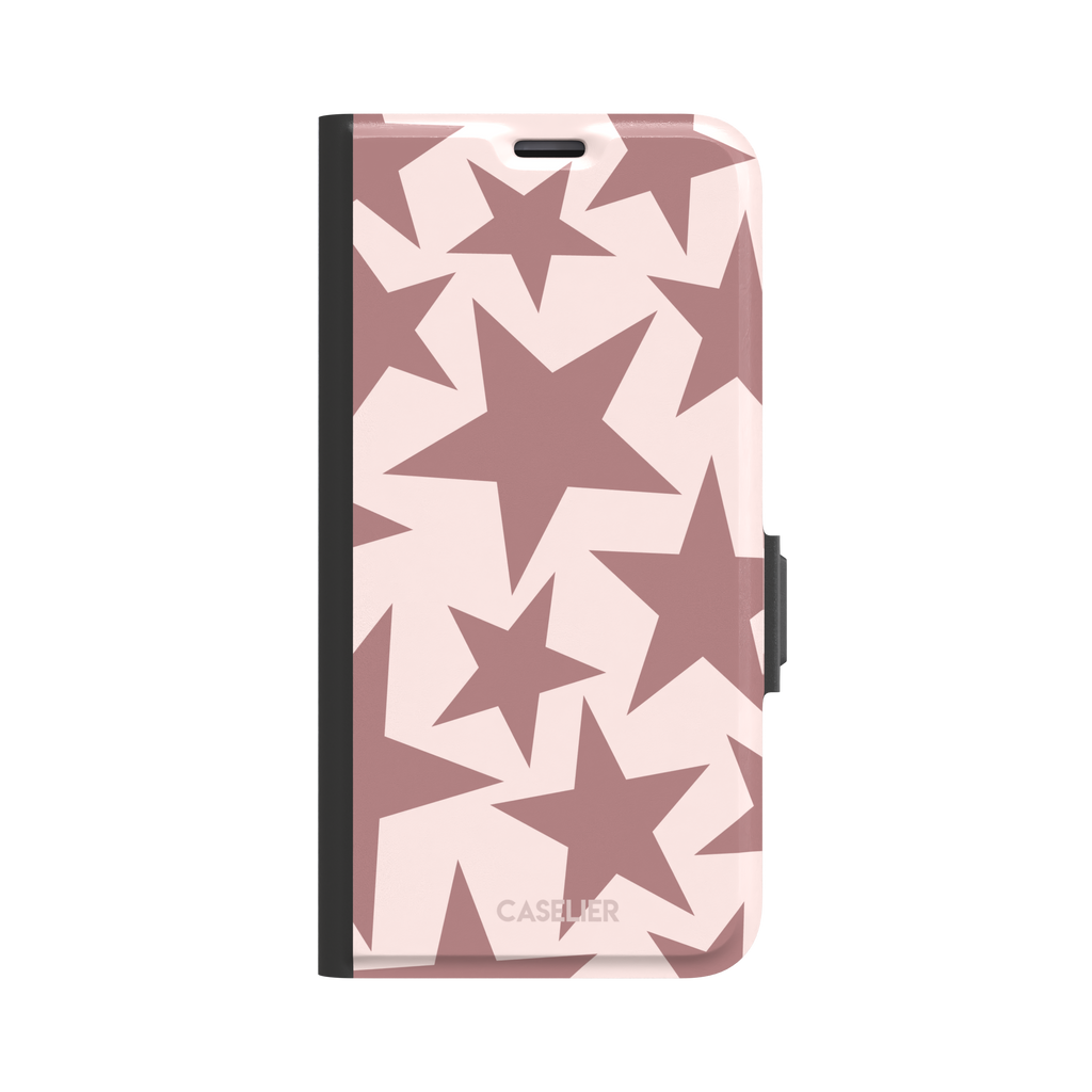 Stars phone case variant in dusty rose and blush pink with oversized scattered star pattern, phone case by Caselier — wallet case, front view