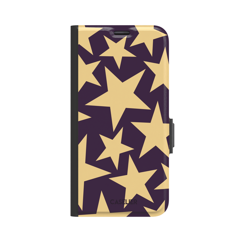 Stars phone case variant in dark purple and soft gold with large tumbling star print, phone case by Caselier — wallet case, front view