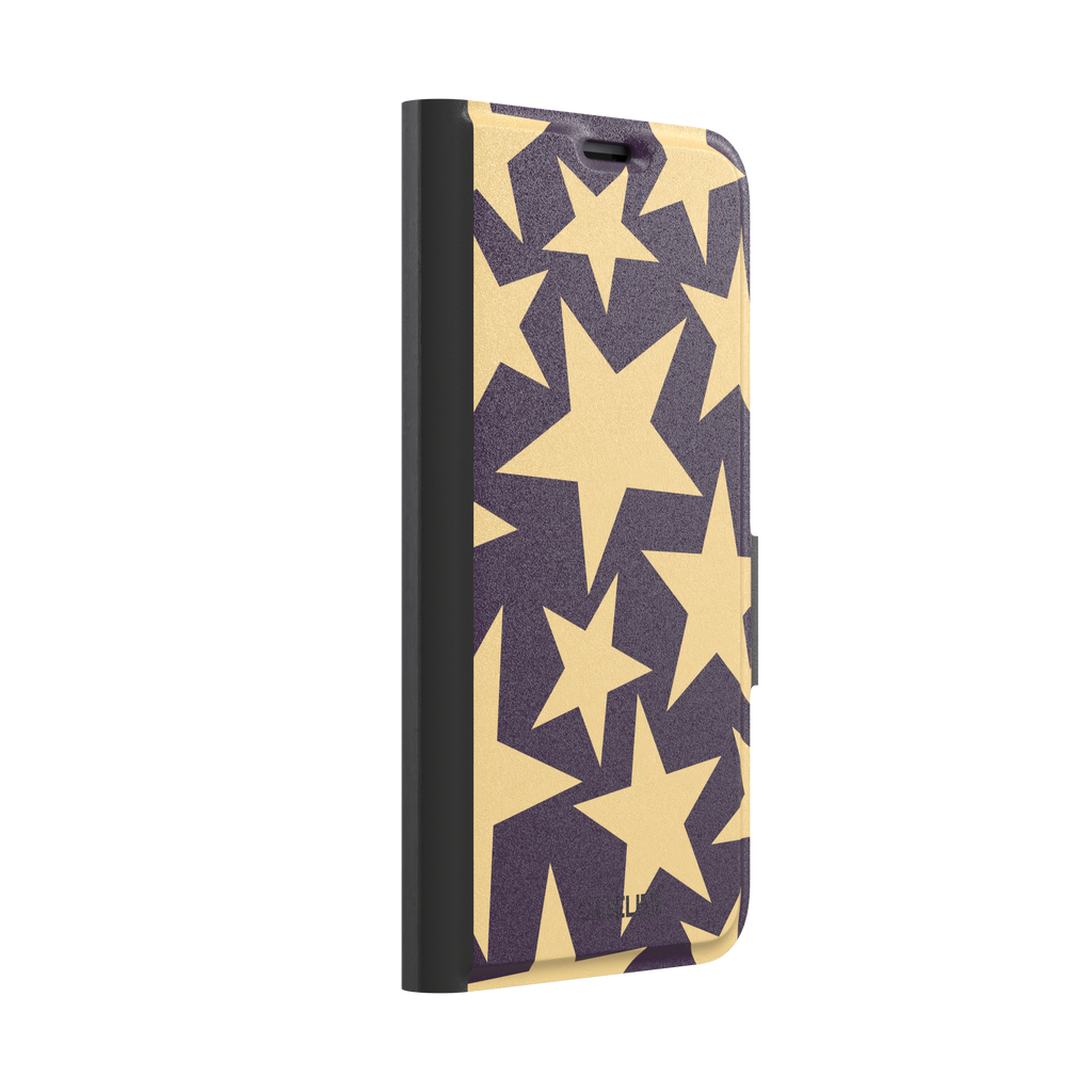 Stars phone case variant in dark purple and soft gold with large tumbling star print, phone case by Caselier — wallet case, left view