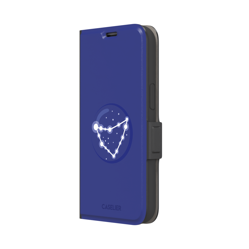 Starsigns phone case showing the Capricorn constellation as a glowing white angular star map inside a blue orb on a cobalt blue case, phone case by Caselier — wallet case, right view