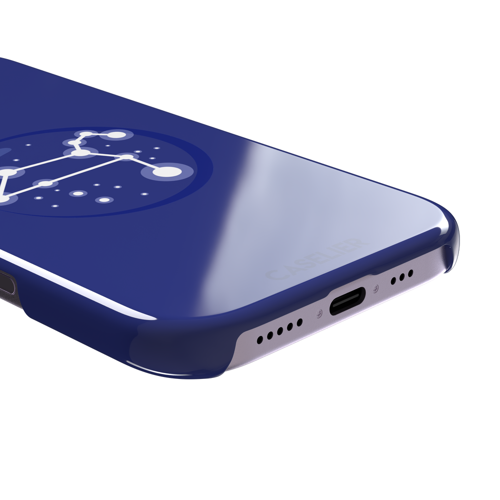 Starsigns phone case showing the Leo constellation as a glowing white quadrilateral star map inside a blue orb on a cobalt blue case, phone case by Caselier — snap case, charging port detail
