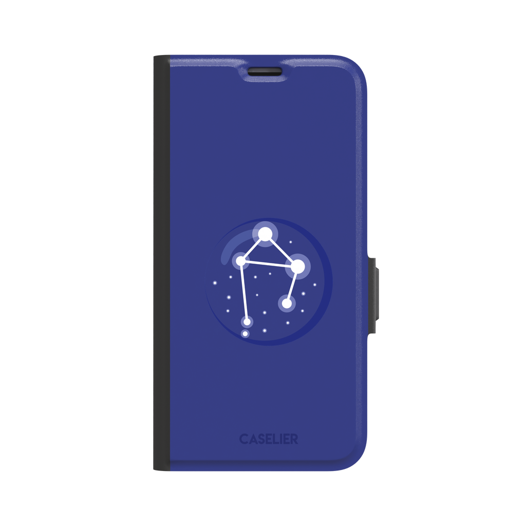 Starsigns phone case showing the Libra constellation as a glowing white balanced star map inside a blue orb on a cobalt blue case, phone case by Caselier — wallet case, front view