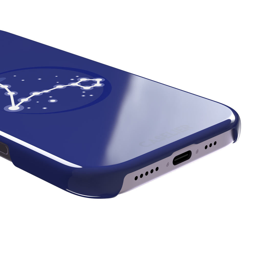 Starsigns phone case showing the Pisces constellation as a glowing white elongated star map inside a blue orb on a cobalt blue case, phone case by Caselier — snap case, charging port detail