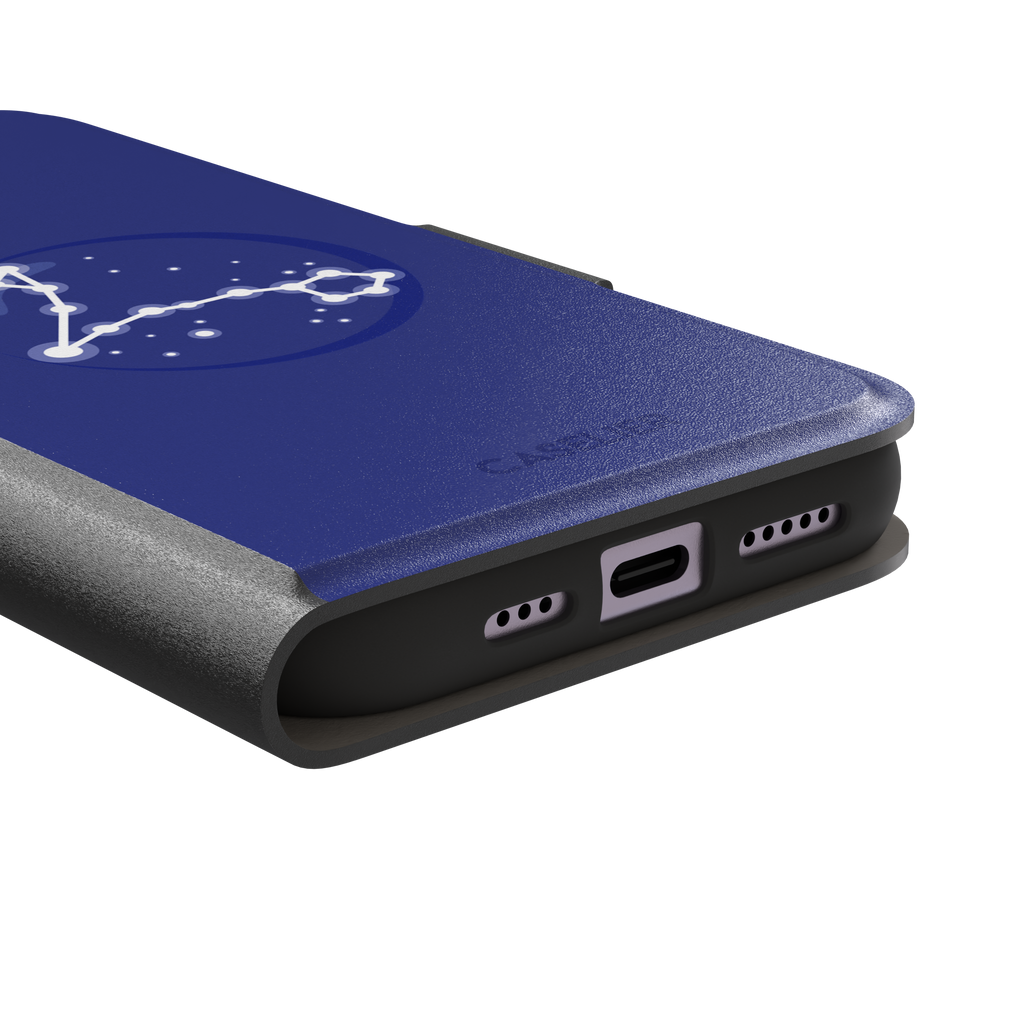 Starsigns phone case showing the Pisces constellation as a glowing white elongated star map inside a blue orb on a cobalt blue case, phone case by Caselier — wallet case, charging port detail