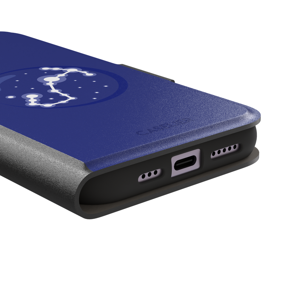 Starsigns phone case showing the Taurus constellation as a glowing white diagonal star map inside a blue orb on a cobalt blue case, phone case by Caselier — wallet case, charging port detail