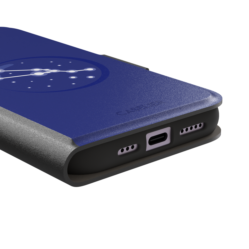 Starsigns phone case showing the Virgo constellation as a glowing white curved star map inside a blue orb on a cobalt blue case, phone case by Caselier — wallet case, charging port detail