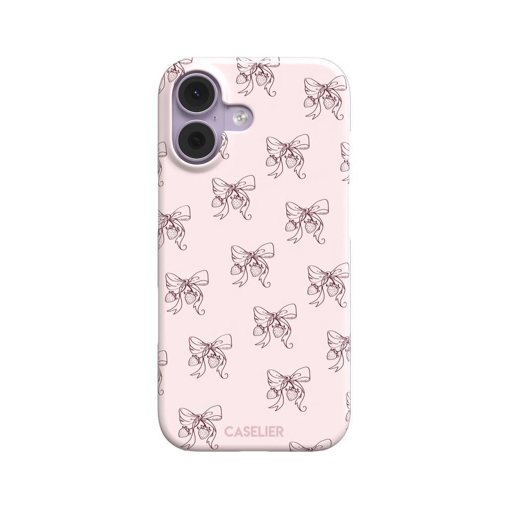 Strawberry Bows phone case in blush pink with an all-over pattern of line-drawn ribbon bows and hanging strawberries, phone case by Caselier — snap case, front view