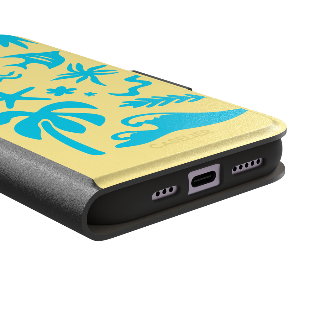 Summer Time phone case in pale yellow with bright turquoise tropical cutout silhouettes including palm trees, starfish, waves and a fish, phone case by Caselier — wallet case, charging port detail
