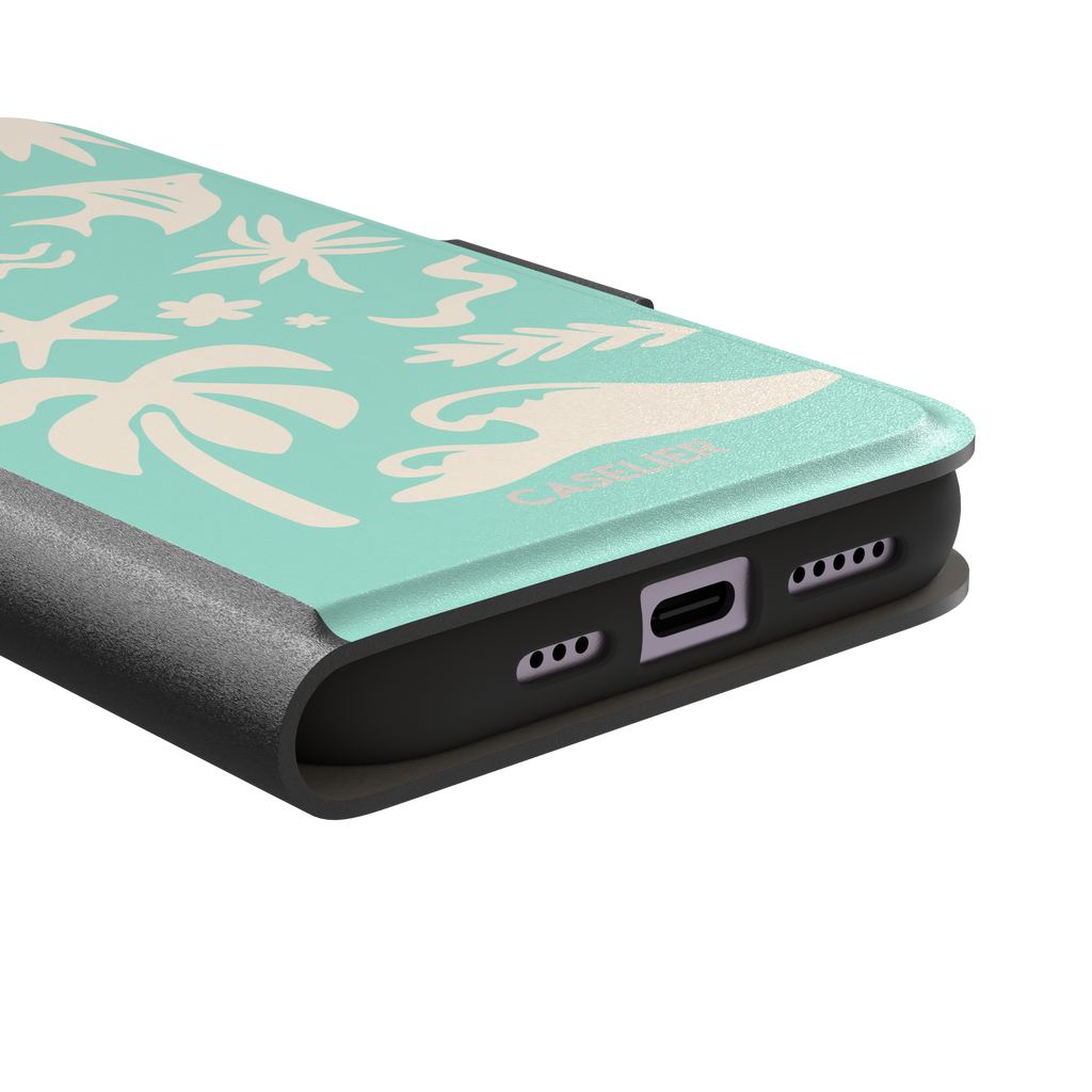 Summer Time phone case in mint green with cream tropical cutout silhouettes including palm trees, starfish, waves and a fish, phone case by Caselier — wallet case, charging port detail