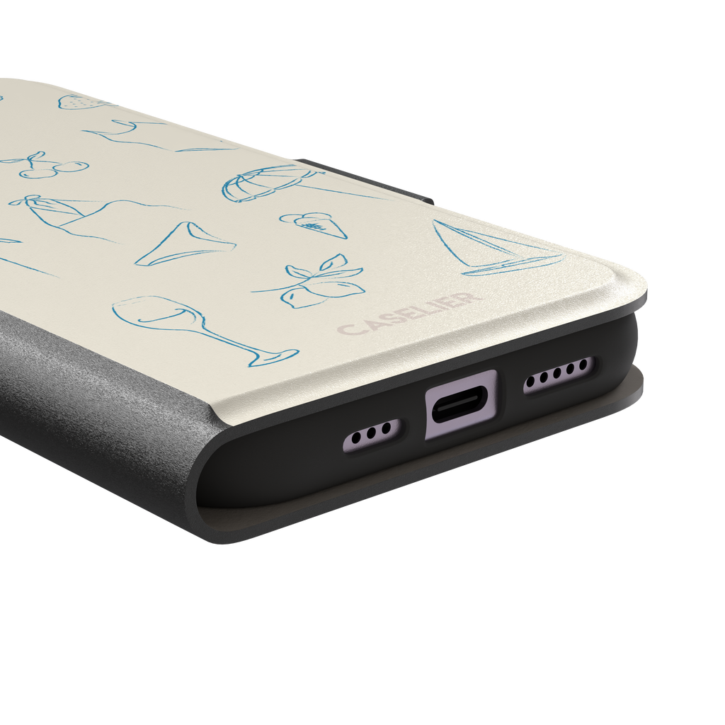 Summer Vibes phone case in all-blue monochrome line-art variant, showing the same beach doodle pattern — hibiscus, sun hat, bikini, wine glass and sailboat — in blue on cream, phone case by Caselier — wallet case, charging port detail
