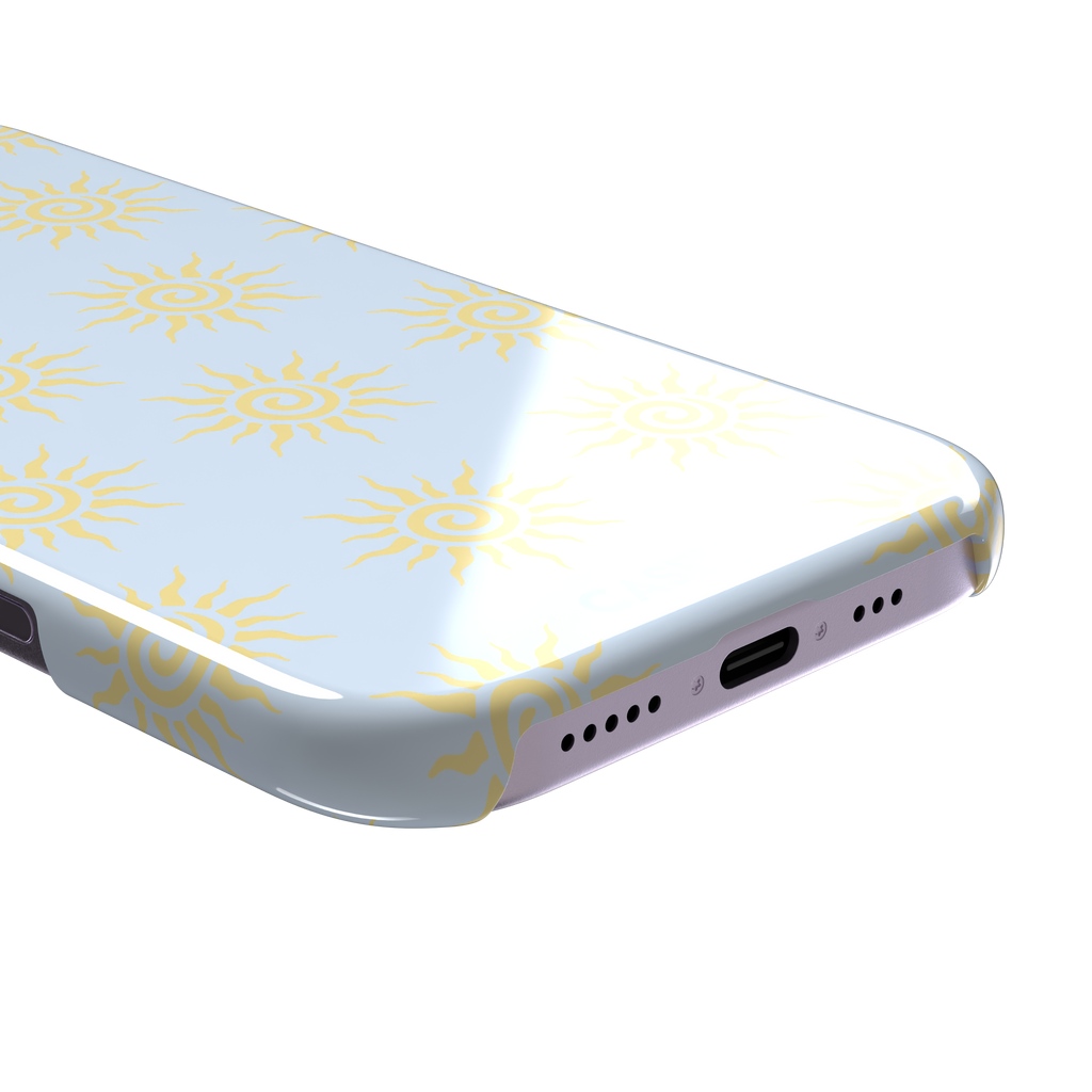 Sunkissed phone case color variant with golden yellow tribal spiral suns on a soft powder blue background, phone case by Caselier — snap case, charging port detail