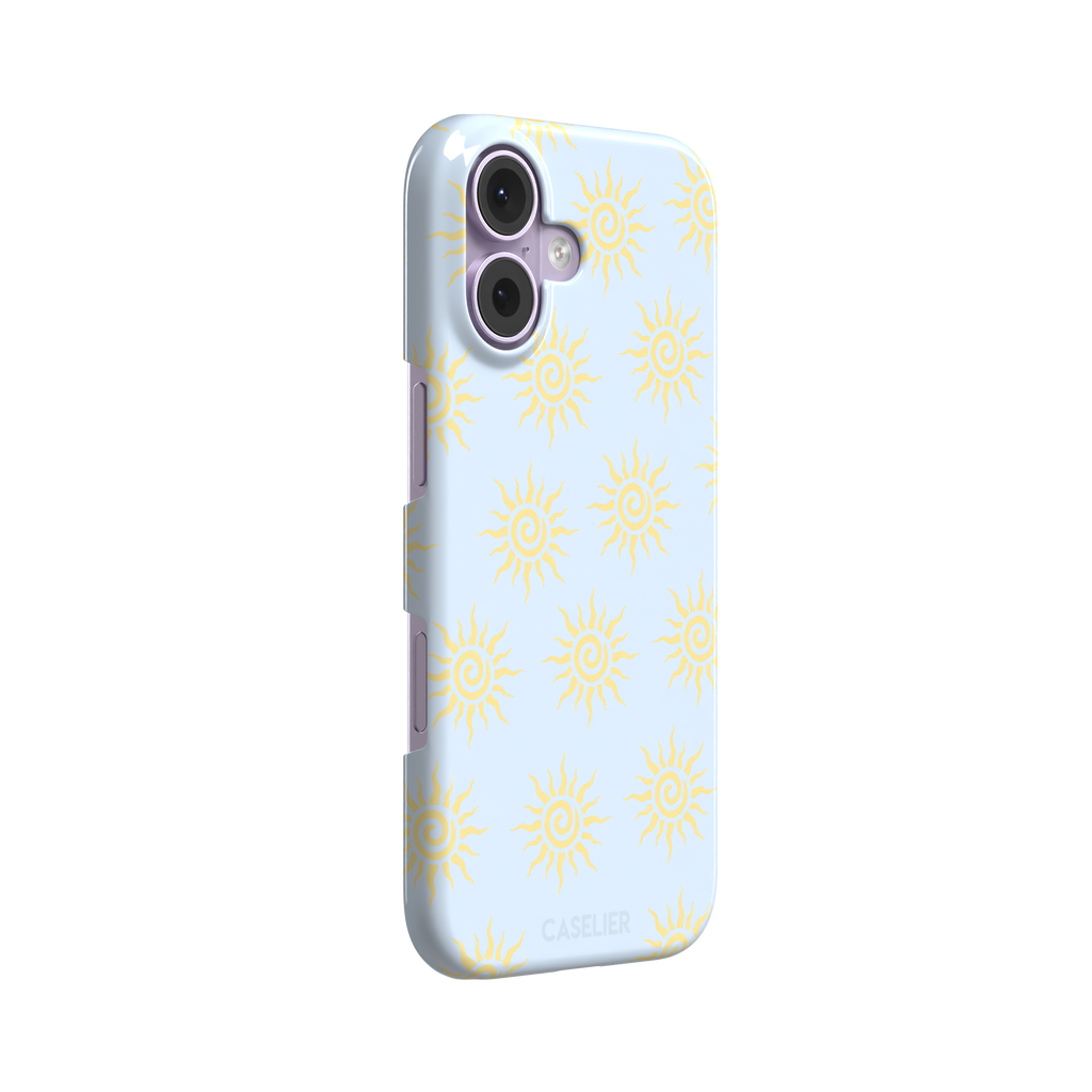 Sunkissed phone case color variant with golden yellow tribal spiral suns on a soft powder blue background, phone case by Caselier — snap case, left view