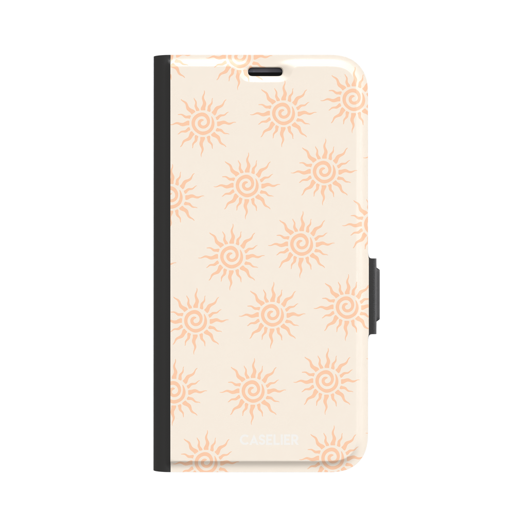 Sunkissed phone case color variant with pale peach tribal spiral suns on a warm cream background, phone case by Caselier — wallet case, front view