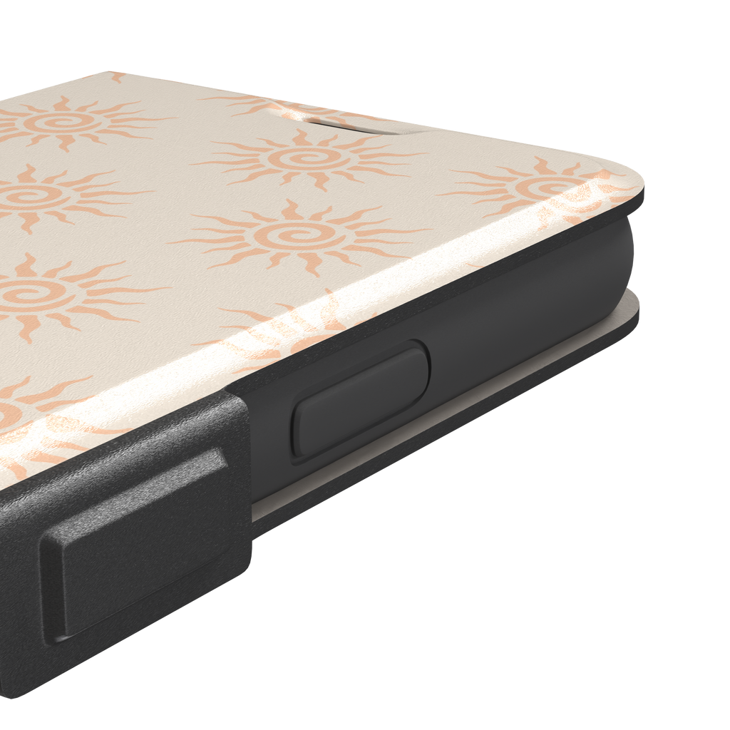 Sunkissed phone case color variant with pale peach tribal spiral suns on a warm cream background, phone case by Caselier — wallet case, volume buttons detail
