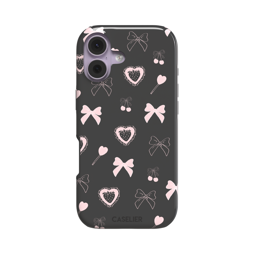 Sweetness Overload phone case in dark charcoal grey with pink bows, cherries, heart lollipops and frilled strawberry heart illustrations — tough case, front view