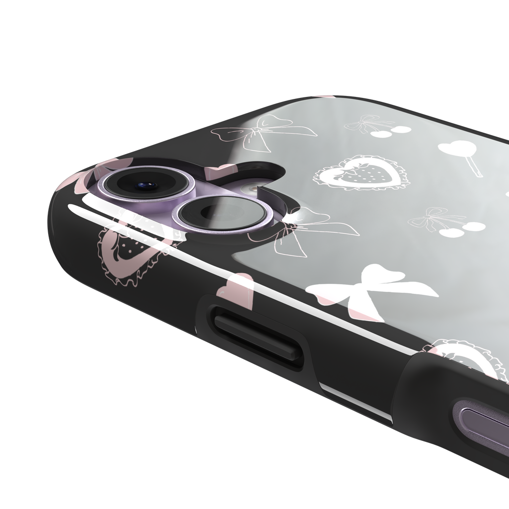 Sweetness Overload phone case in dark charcoal grey with pink bows, cherries, heart lollipops and frilled strawberry heart illustrations — tough case, volume buttons detail