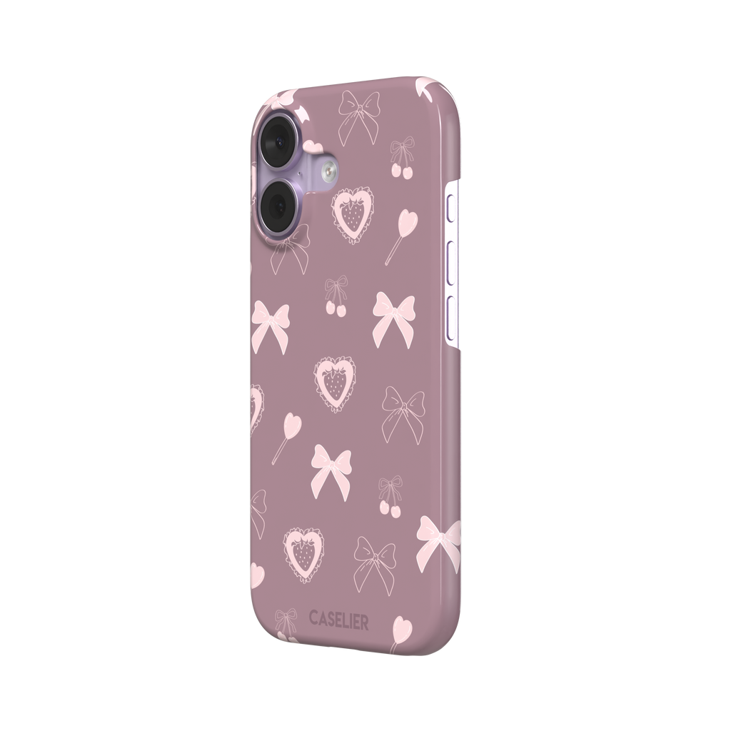 Sweetness Overload phone case in dusty pink with soft pink bows, cherries, heart lollipops and frilled strawberry heart illustrations — snap case, right view