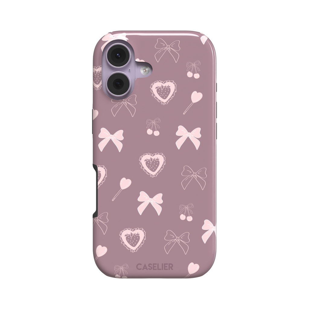 Sweetness Overload phone case in dusty pink with soft pink bows, cherries, heart lollipops and frilled strawberry heart illustrations — tough case, front view