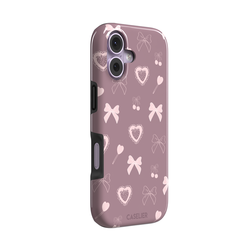 Sweetness Overload phone case in dusty pink with soft pink bows, cherries, heart lollipops and frilled strawberry heart illustrations — tough case, left view