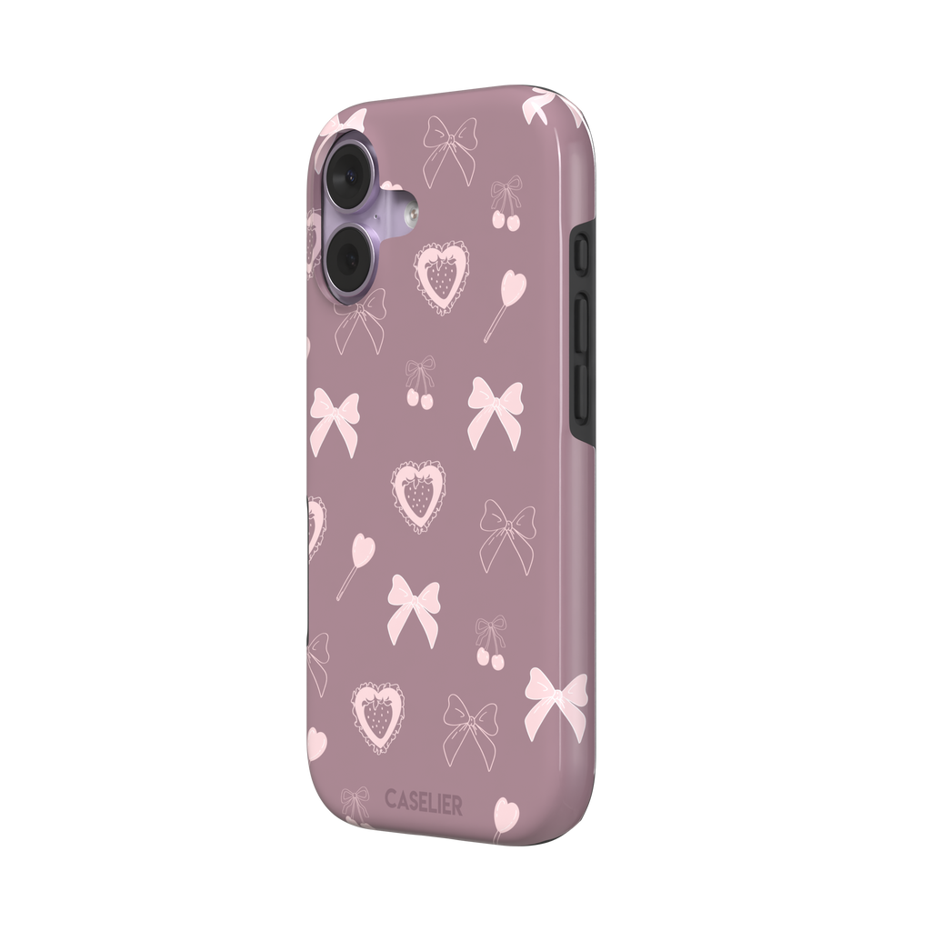 Sweetness Overload phone case in dusty pink with soft pink bows, cherries, heart lollipops and frilled strawberry heart illustrations — tough case, right view