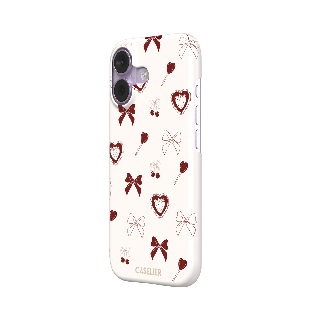Sweetness Overload phone case in cream white with deep red bows, cherries, heart lollipops and frilled strawberry heart illustrations — snap case, right view