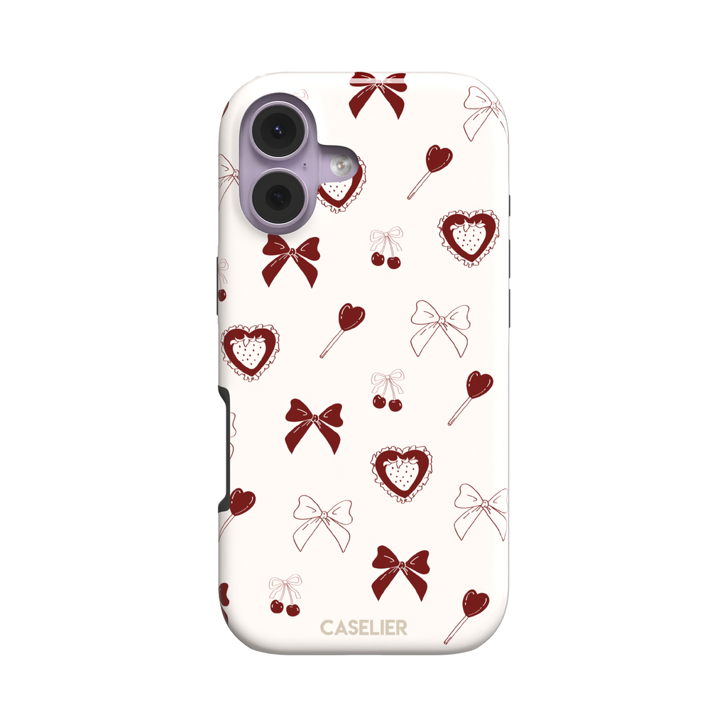 Sweetness Overload phone case in cream white with deep red bows, cherries, heart lollipops and frilled strawberry heart illustrations — tough case, front view