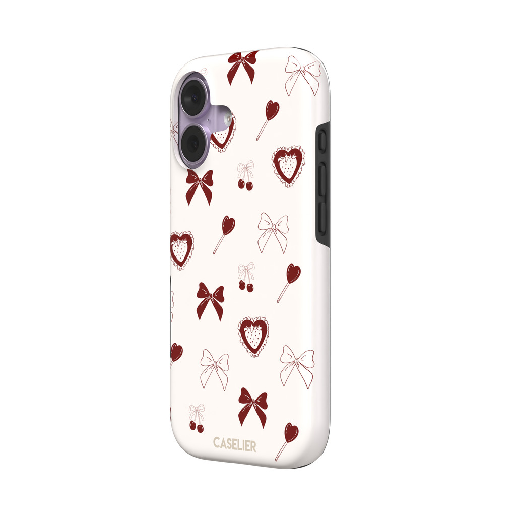 Sweetness Overload phone case in cream white with deep red bows, cherries, heart lollipops and frilled strawberry heart illustrations — tough case, right view