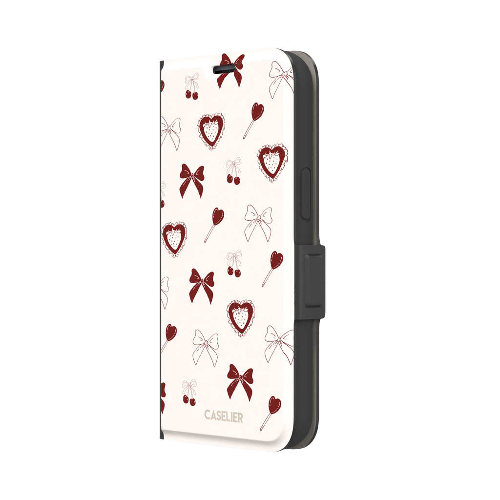 Sweetness Overload phone case in cream white with deep red bows, cherries, heart lollipops and frilled strawberry heart illustrations — wallet case, right view