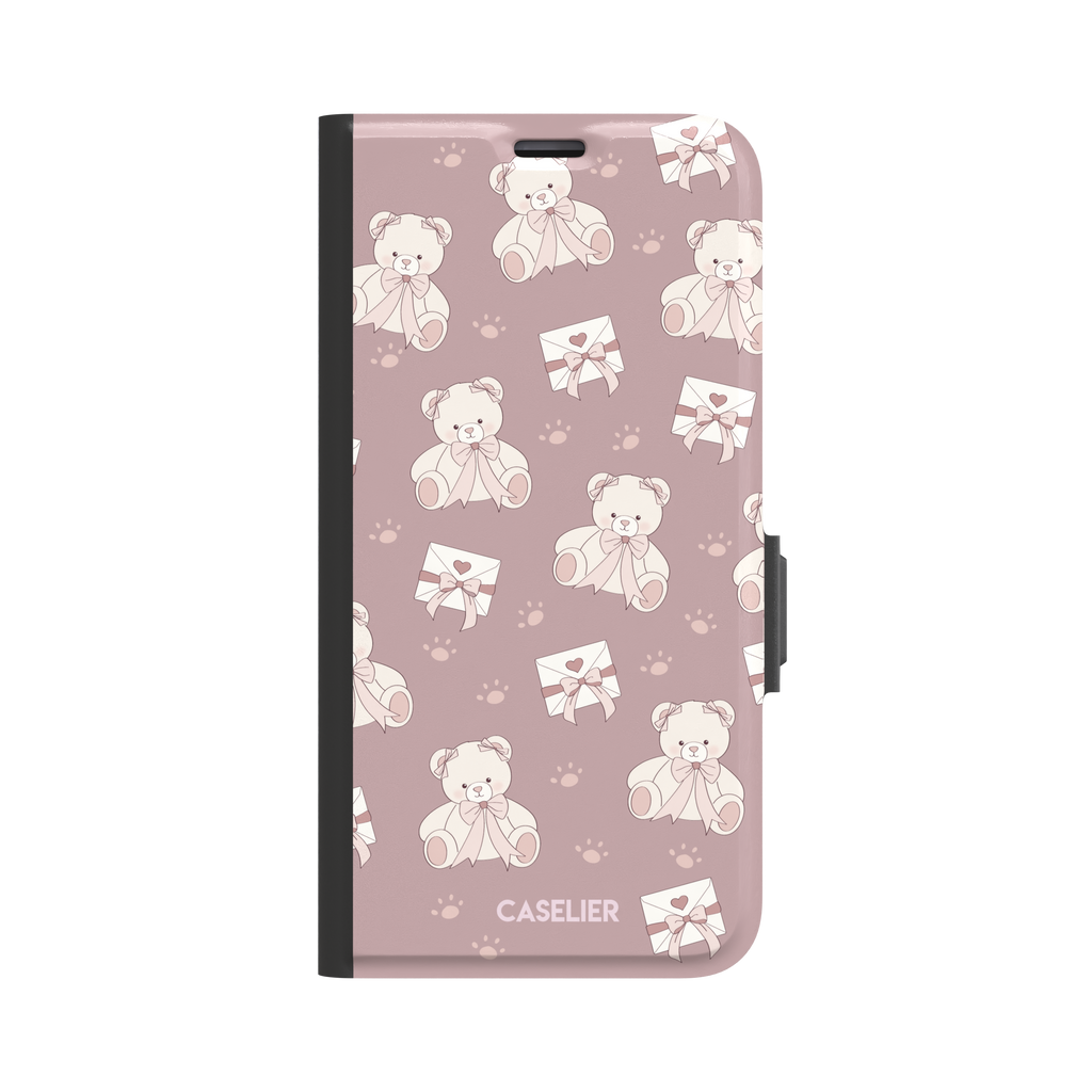 Ted the Teddy phone case in dusty mauve-pink colorway with cream teddy bears, ribbon bows and heart envelope motifs in a coquette repeat pattern, by Caselier — wallet case, front view
